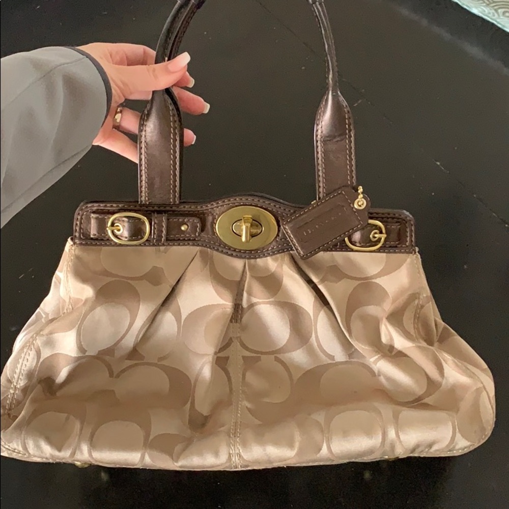 Used Coach original C leather strap bag.